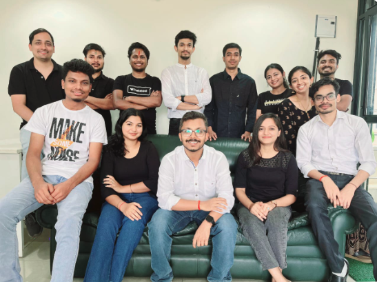 Group photo of the WhatsTool team in the office