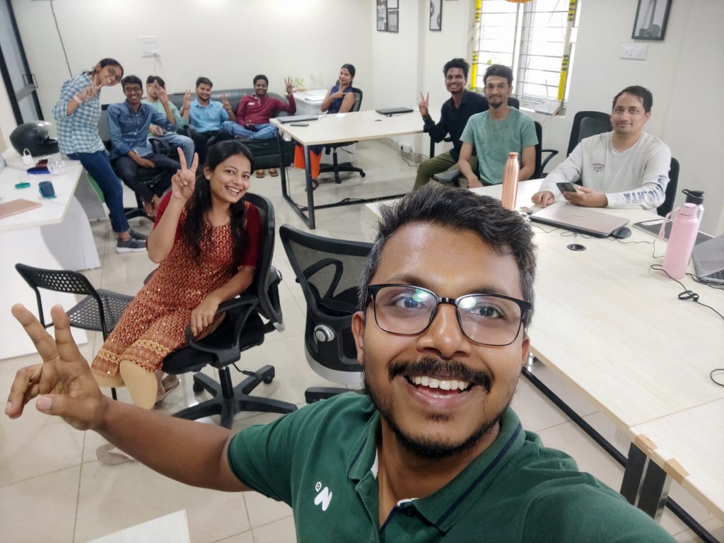 Office selfie with teammates at their desks